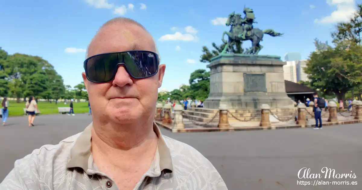 Alan Morris next to a statue of Kusunoki Masashige in the Imperial Palace outer garden inTokyo.